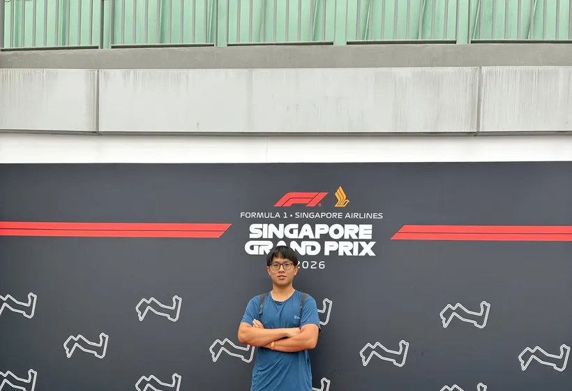Low Cheng Jun standing on a Formula 1 Singapore Grand Prix podium display